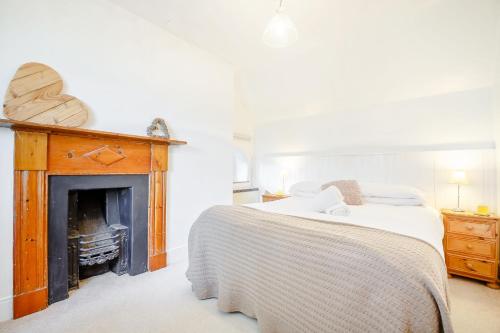 Tempat tidur dalam kamar di Braich-Y-Celyn Lodge