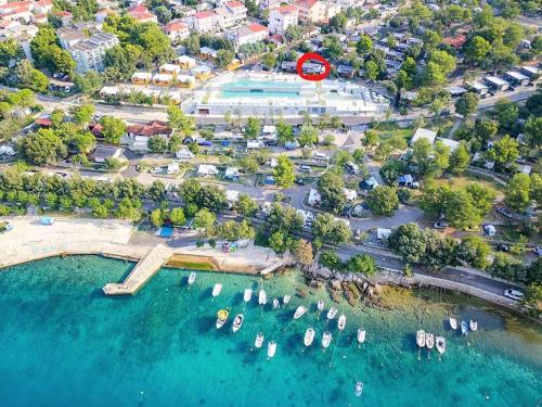an aerial view of a harbor with boats in the water at Mobile home LUNA Selce in Selce