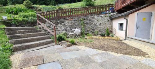 a set of stairs next to a stone building at Apartments Nähe Red Bull Ring in Proleb