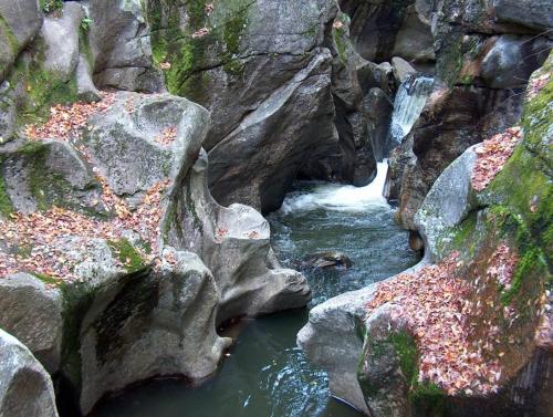 a stream of water with rocks in a canyon at Exposed Beam 3BR Modern Mountain Retreat in Thornton