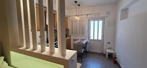 a room with a kitchen and a dining room at Hera gk apts in Chania Town