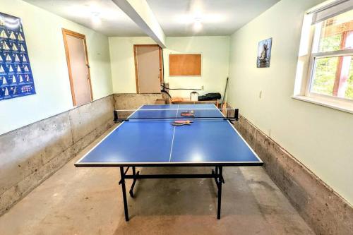 a room with four ping pong tables in it at Villa w/ Amazing Bay Views Near Beach w/ Garden, Ping Pong in Eastsound