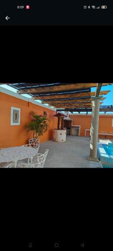 a room with a pool and a table with a plant at Hotel Hacienda Morales. in Guanajuato