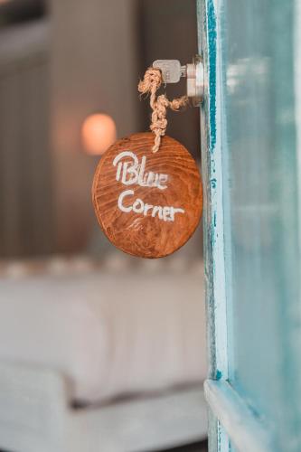 a tag that says blue corner on a door at The Shacks at Sandy Bay in Nusa Lembongan