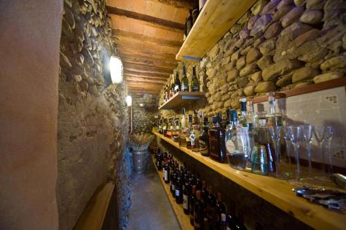 a bar with a bunch of bottles of wine at B&B Le Dimore Mezza Costa in San Casciano in Val di Pesa