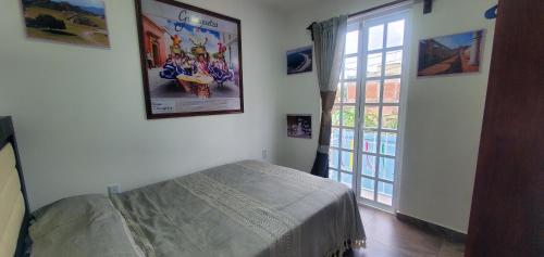 Ένα ή περισσότερα κρεβάτια σε δωμάτιο στο Hostal Guelaguetza Baño Compartido