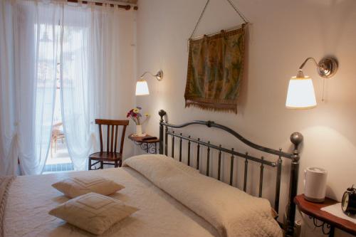 Una cama o camas en una habitación de Il Tomolo