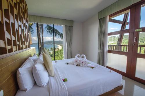 Postel nebo postele na pokoji v ubytování Peach Blossom Resort & Pool Villa - SHA Plus