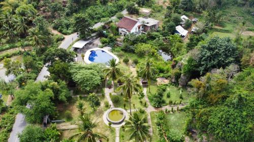an aerial view of a house with a swimming pool at Cersen Resort Lombok in Kuta Lombok