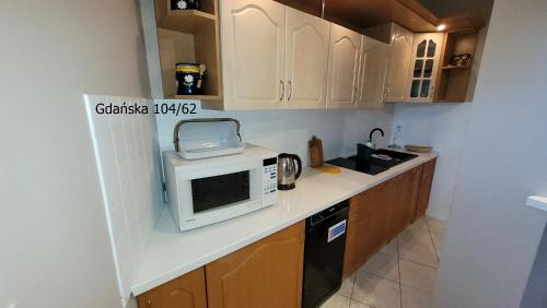 Küche/Küchenzeile in der Unterkunft Apartament Gdańska 104/62