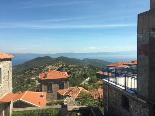 a view of the ocean from a building at Traditional village house in Kleió