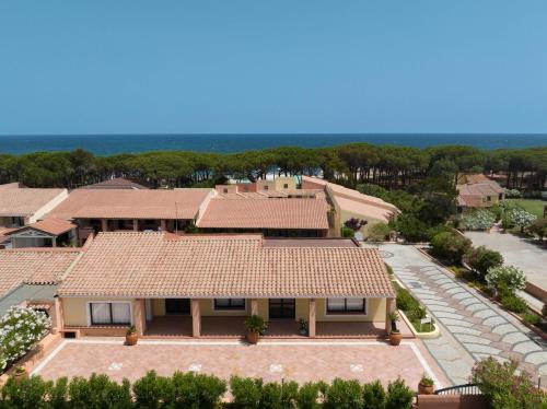an aerial view of a house with a roof at Club Hotel Marina Seada Beach in Budoni