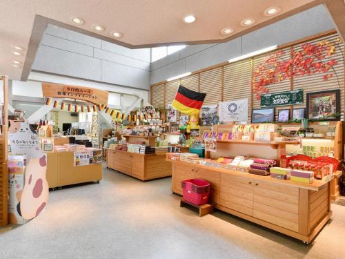 a store with a lot of items on display at momijigawa onsen in Naka
