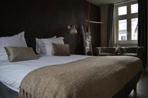 Boutique hotel van Hamにあるベッド