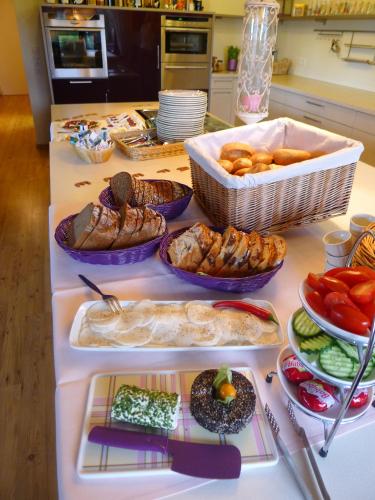 a table with many different types of food on it at Landhaus Schoenen in Sasbachwalden