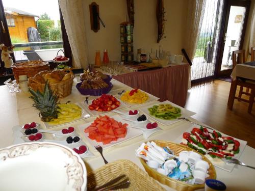 a table with many different types of food on it at Landhaus Schoenen in Sasbachwalden