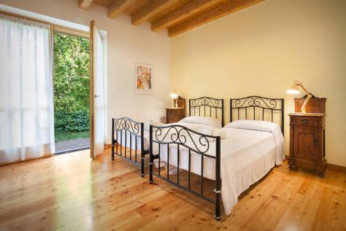Posteľ alebo postele v izbe v ubytovaní Casa del Bosco