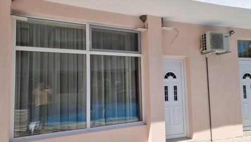 a house with a window and a door at Бутикови Студиа БРИТА in Kranevo