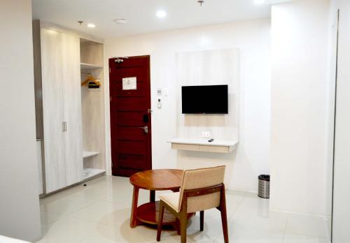 Carlosta Hotelにあるテレビまたはエンターテインメントセンター