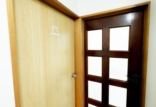 a door with a window in a room at Lake Toya and Nakajima in Lake Toya