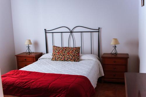 Кровать или кровати в номере Casa El Nisperero