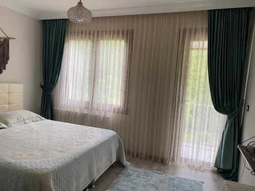 Giường trong phòng chung tại Doğa villa