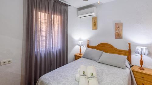 A bed or beds in a room at Villa José Andrés Torrox by Ruralidays