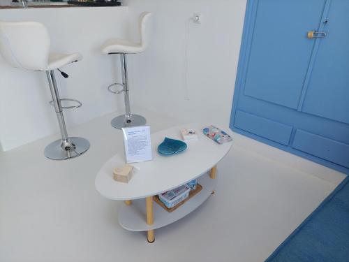 a table in a room with a chair and a mirror at BAROS VIEW in Apérathos