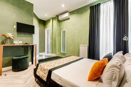 Cama o camas de una habitación en Ripetta Luxurious Suites