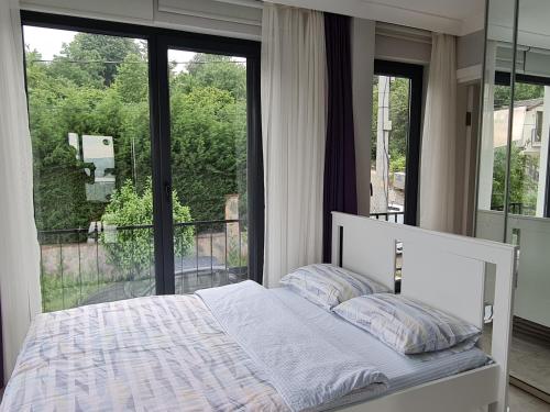 Ένα ή περισσότερα κρεβάτια σε δωμάτιο στο KD Apartments