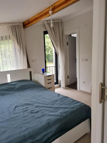 Ένα ή περισσότερα κρεβάτια σε δωμάτιο στο KD Apartments
