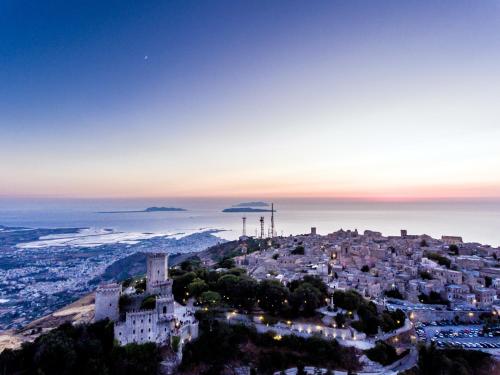 an aerial view of a city at night at La Loggia di Trapani in Trapani