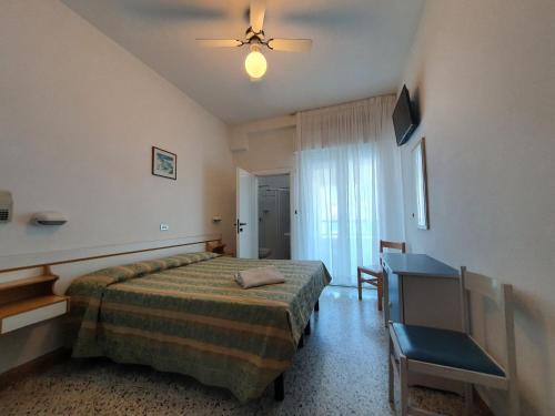 Katil atau katil-katil dalam bilik di Hotel Moresco - Piscina Beach Village
