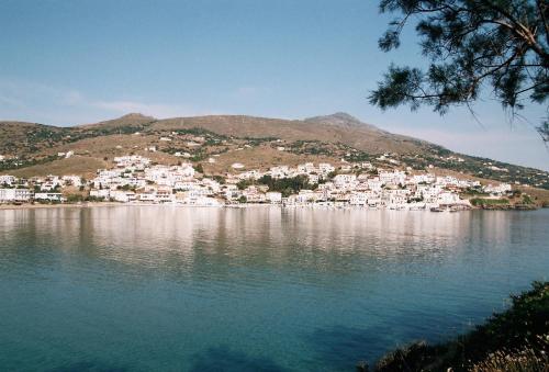 a view of a town on a hill next to the water at Karanasos in Batsi