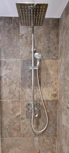 a shower with a hose in a bathroom at VILLA VERAMAR in Finestrat
