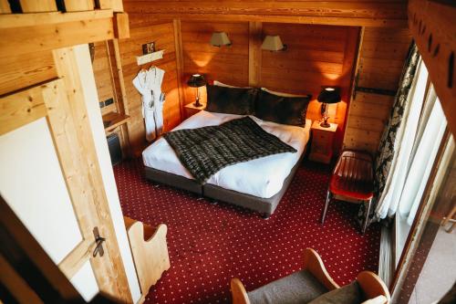 Un ou plusieurs lits dans un hébergement de l'établissement Les Grands Montets Hotel & Spa