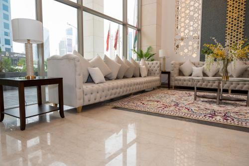 a living room with a couch and a table at City View Hotel- Managed by Arabian Link International in Kuwait
