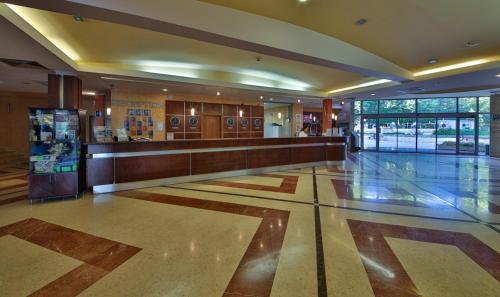 a lobby with a counter and a lobby at Calimera Ralitsa Superior Hotel - Ultra All Inclusive plus Aquapark in Albena