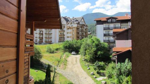 a view from a building looking down a dirt road at St Ivan Rilski Spa Luxury apartment Bansko & Free SPA in Bansko