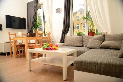 a living room with a couch and a table at Ferienanlage Markus Nitsch in Bärenstein