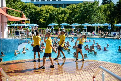 a group of people playing in a swimming pool at Calimera Ralitsa Superior Hotel - Ultra All Inclusive plus Aquapark in Albena