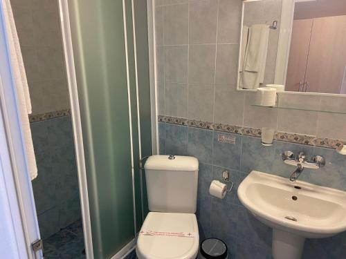 a small bathroom with a toilet and a sink at Sirena Hotel- ALL INCLUSIVE in Sunny Beach