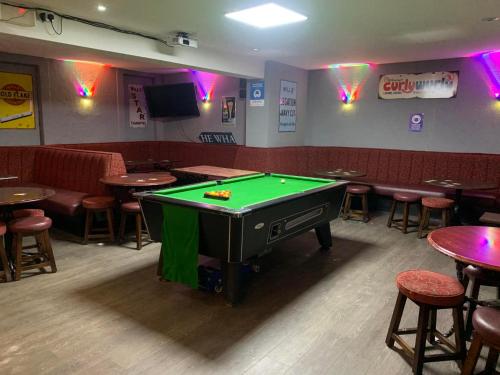 a room with a pool table in a bar at Cutty Sark Inn in Eyemouth