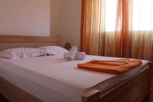 a bed with two towels on top of it at Jovan Vukovic in Kotor