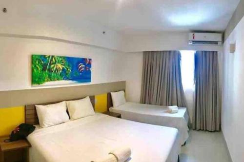 Un ou plusieurs lits dans un hébergement de l'établissement OLIMPIA PARK RESORTs "MELHOR PREÇO "