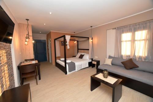 a hotel room with a bed and a couch at Shining Star Petra in Petra