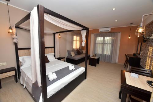a hotel room with a bed and a couch at Shining Star Petra in Petra