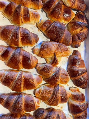 a group of croissants on a baking sheet at Dordogne et Corrèze vacances BnB in Troche