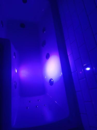 a blue light in a room with a tile floor at Withnell Stays - Apartment Five in Blackpool