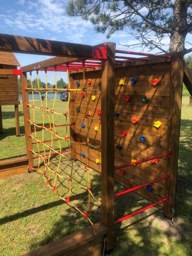 a climbing wall in a backyard at Sárberki Horgásztó in Lenti